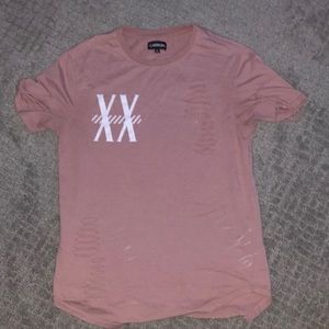 I am selling a pinkish shirt wit white design on it.